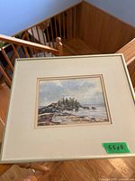 Framed print on stair railing showing entire piece