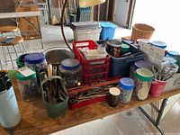 overall view of table with jars, bins and tools