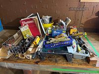Wide view of all painting tools and supplies on workbench