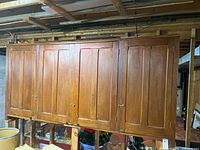 front view of entire wooden cabinet with four doors