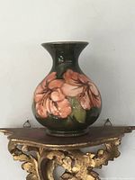 Front view of Moorcroft vase showing floral decoration