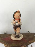 Front view of Goebel Hummel School Boy figurine