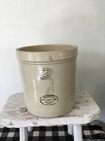 Front view showing full crock with printed capacity and maker's stamp