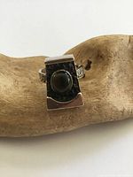 Front view of sterling silver ring with tiger’s eye cabochon