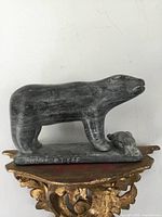 Full view of soapstone bear and seal on base