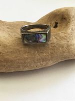 Ring top showing abalone inlay and tarnished sterling silver band
