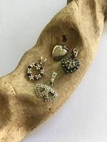 Front view showing all four sterling silver heart charms