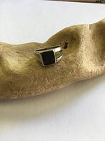 Front view of sterling silver ring with square onyx setting