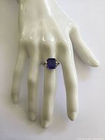 Ring on mannequin hand showing scale and design