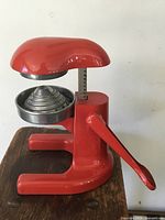 Left side view showing handle, base, reamer and cup