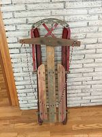 Front view of folded vintage wood sled