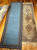 Both runner rugs side by side showing patterns and dimensions