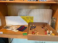 Shelf view showing wall panels, styrene sheet, tray of miniatures