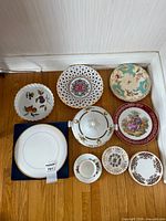 Group shot of all ten ceramic pieces laid on floor