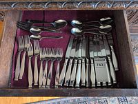 Overall drawer view showing forks, knives, spoons