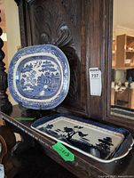 Both blue and white transferware platters on display