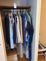 Closet rod with full selection of garments on hangers