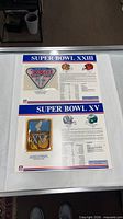 Both Super Bowl patches on display cards
