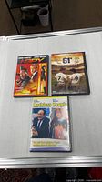 Front view of three DVD cases: I-Spy, 61*, Ruthless People