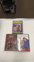 Front covers of all three DVD cases displayed on tabletop