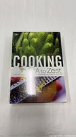 Front of sealed Cooking from A to Zest box showing title and cover art