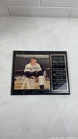Full view of framed signed Mickey Mantle photo and adjacent plaque