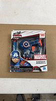 Front view of sealed Nerf MicroShots Captain America blaster in box
