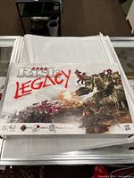 Closed Risk Legacy box top showing title artwork
