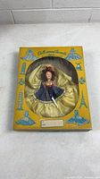 Front view of boxed doll