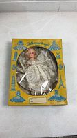 Front of boxed bride doll