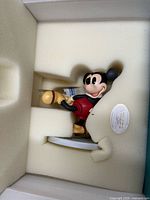 Figurine inside protective foam with WDCC sticker visible