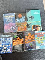 Front covers of all seven paperbacks