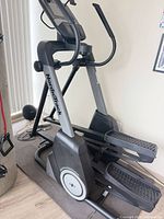 Side view of NordicTrack FS9i elliptical on floor mat