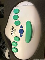 Top view of 6dot Braille Label Maker seated in foam case with cartridges visible