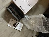 Detector unit, user manual, bubble wrap and box visible