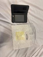 Nintendo 3DS XL open and bubble wrap