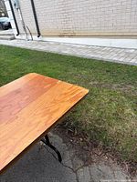 Table top corner detail showing plywood surface and finish