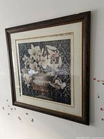 Full view of framed floral print on wall