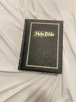 Front cover black leatherette Holy Bible with gold embossing