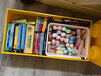 Storage box opened showing flash card decks and chalk tray