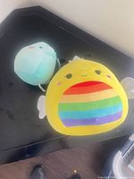 Both Squishmallows plush toys on surface