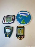 All four handheld games laid out