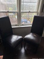 Both dining chairs positioned side by side showing full front view
