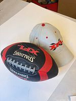 Football and hat grouped to show overall lot