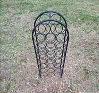 Front view of full wine rack showing circular bottle holders
