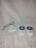Both mice and charging cradle full view