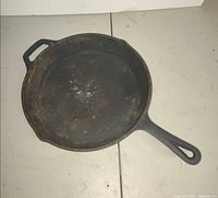 Top view of cast iron skillet showing interior surface and handles
