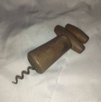 front view of wooden corkscrew showing handle and metal worm