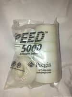 Front of sealed bag showing six stacked rolls plus one loose, Pregis branding visible