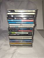 Side view of 20 CD jewel cases showing spines